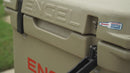 A tan, durable cooler with the word Engel Coolers on it.