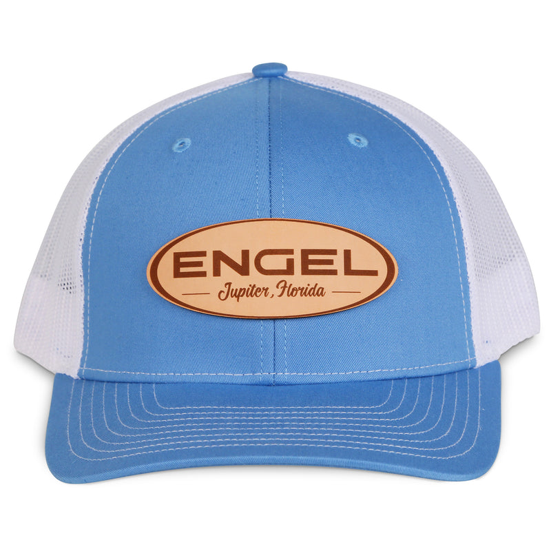 A blue and white Engel Columbia Blue & White 112 Trucker Cap by Richardson®, featuring a breathable mesh back and an Engel Leather Patch on it.