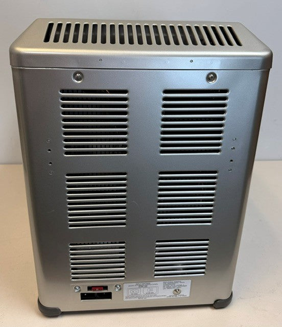 The Engel MT45 Combination Platinum Series Top Opening Fridge-Freezer by Engel Coolers features a metal electronic body with a vented back panel, visible power switch, and label near the base. Designed for reliable performance, it serves as a 45Qt fridge and freezer compatible with 12/24V DC and 110/120V AC power sources.