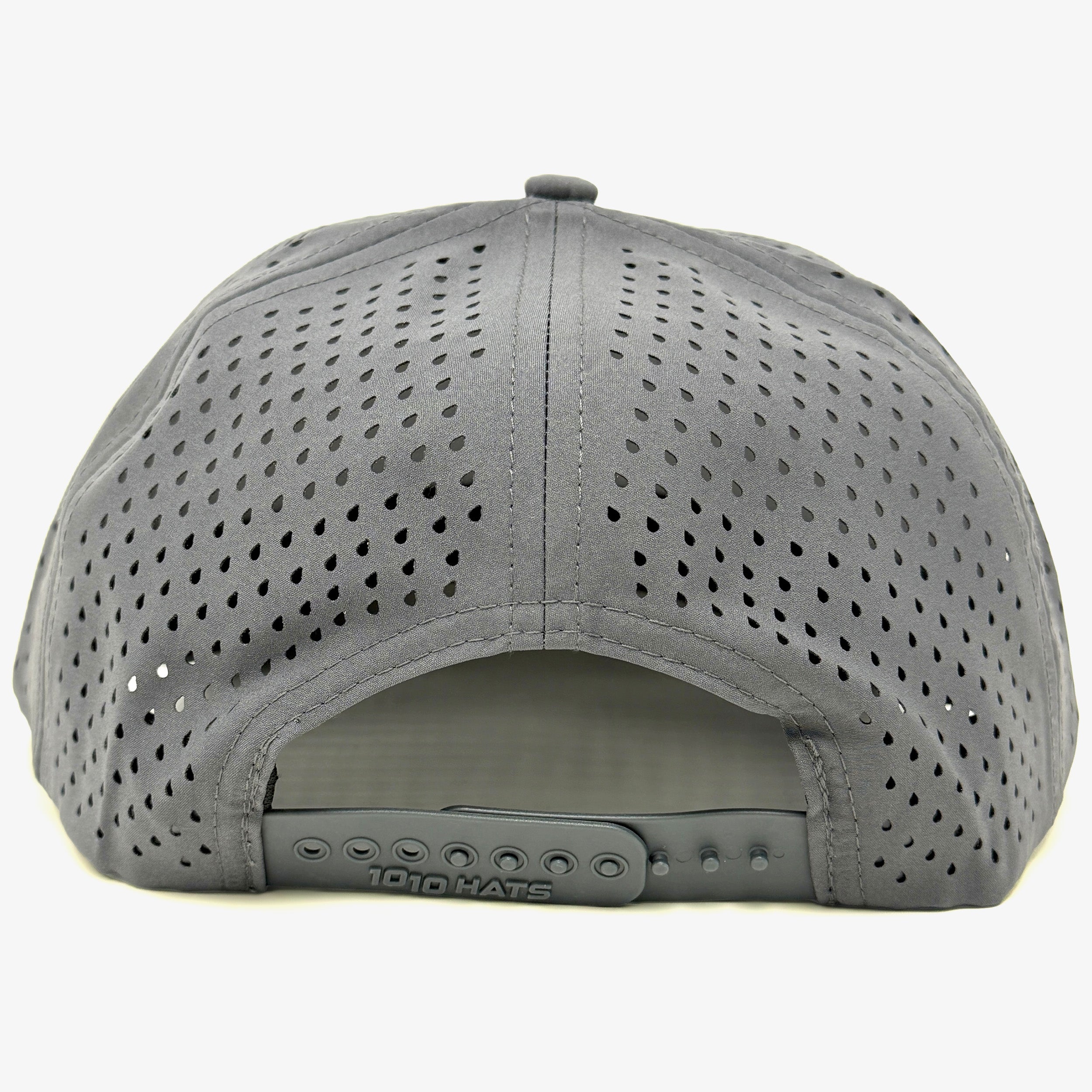 The Engel Coolers 1010 Performance Trucker Cap is a gray, breathable mesh hat shown from the back with an adjustable snapback closure embossed with "1010 HATS" on the strap.
