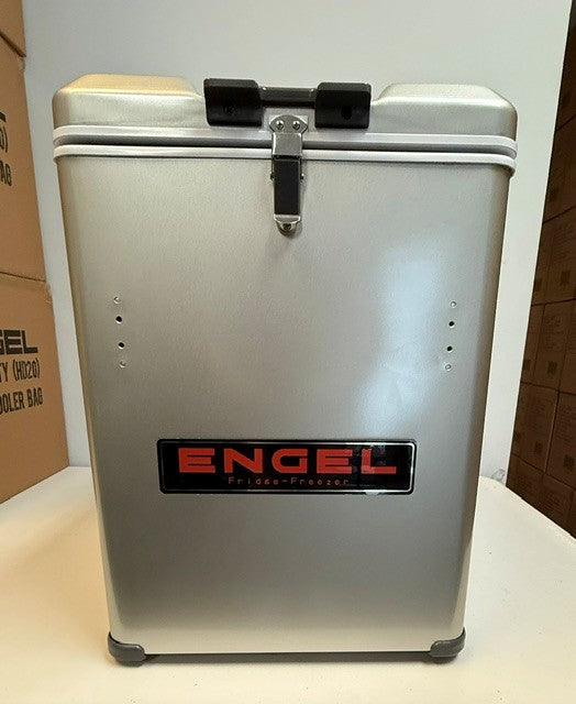 A refurbished Engel MT45 Platinum Series portable fridge-freezer from Engel Coolers stands upright on the floor, featuring a latch on top and a prominent black and red Engel logo on the front. With a spacious 45-quart capacity and rugged durability, this unit is ideal for any adventure.