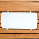 A white Engel Coolers seat cushion on a wooden surface.