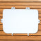 A white seat cushion for Engel Hard Cooler on a marine grade wooden background.