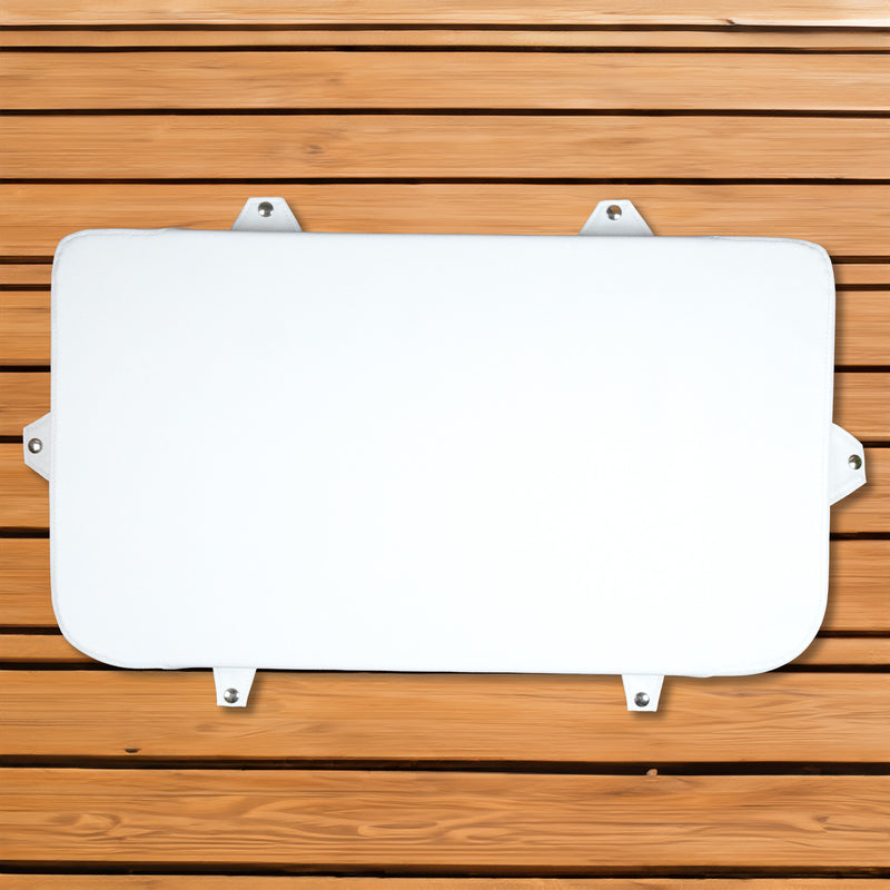A white plate on a wooden surface with an Engel Coolers marine-grade seat cushion.