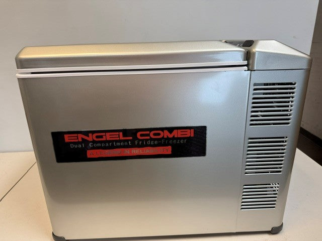 The Engel Coolers MT45 Combination Platinum Series Top Opening 12/24V DC -110/120V AC Fridge-Freezer, a dual compartment unit with vent openings on the side and featuring the reliable Swing Motor Compressor, sits on a white surface against a plain background.