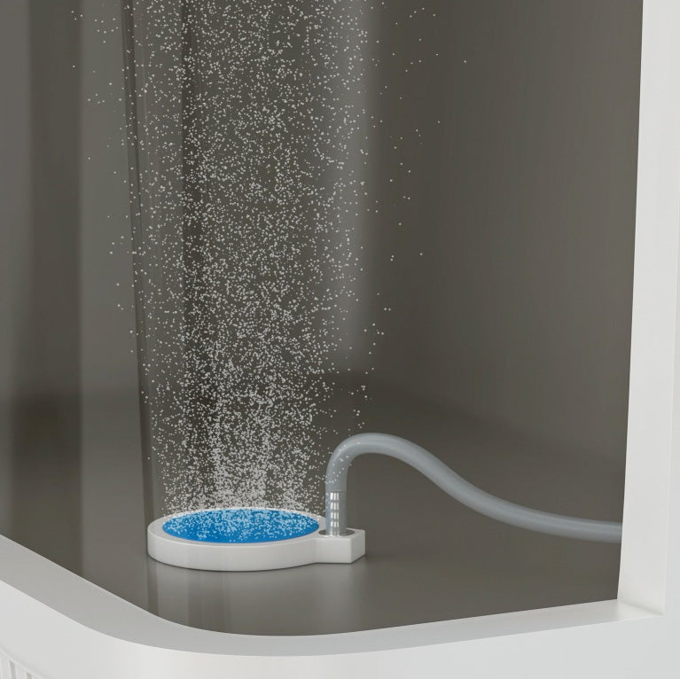 The ENGEL 2" Live Bait Aerator Stone connects to a hose and acts as a bubble diffuser, releasing fine bubbles into the water of a glass tank.