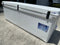 A white Engel Coolers 320 High Performance Hard Cooler and Ice Box sitting on a driveway.