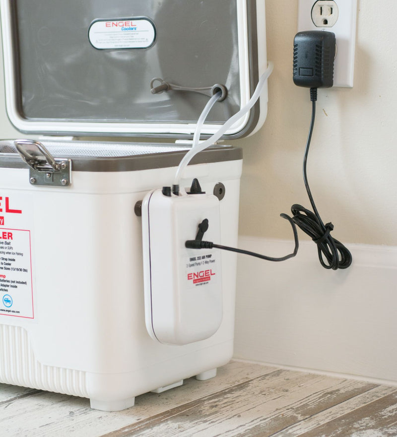 A white Engel Coolers Live Bait Cooler with a AC Adapter for Engel Live Bait Pump attached to it.