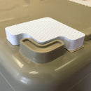 A plastic container with a piece of paper on it, featuring Engel Coolers Drybox Cooler Foam Feet for stabilizing.