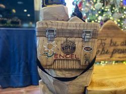Beautiful Chainsaw Memorial Bench for a beloved son includes a carving of his favorite Engel cooler.