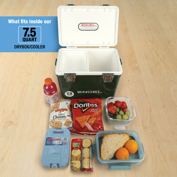 An open Engel Coolers 7.5 Quart Drybox/Cooler with compartments, displayed on a wooden floor and surrounded by sports drink, cookies, chips, crackers, fruit, and a sandwich—all as essential outdoor adventure gear.