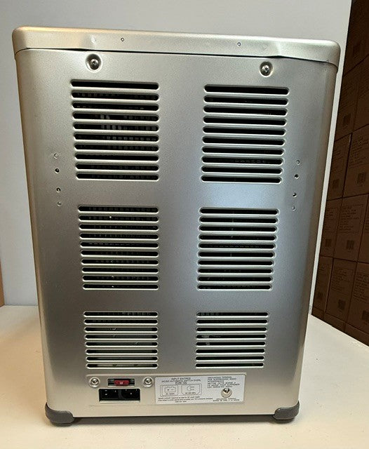 The rear view of the Engel Coolers MT45 Platinum Series (Refurbished) portable fridge-freezer features a metallic electronic unit equipped with several ventilation grilles, a power switch, a power socket, and a white label displaying technical information near the bottom.