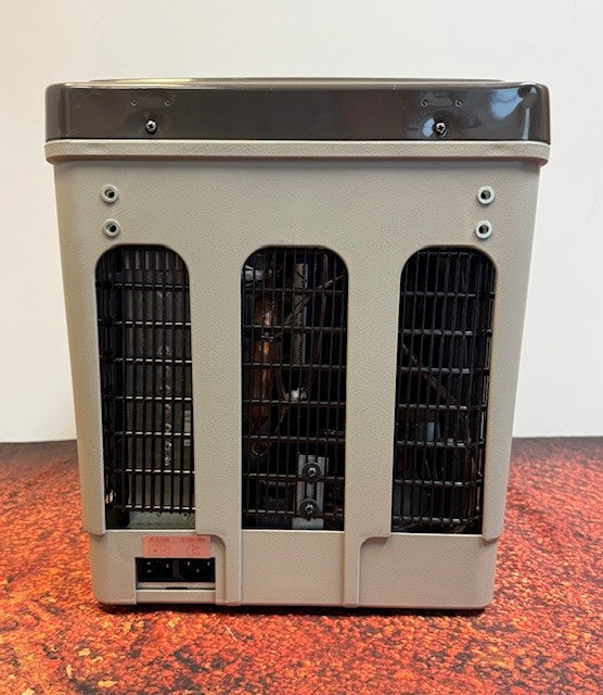 A gray Engel MT17F top-opening fridge-freezer by Engel Coolers, with black vents and a control panel on the lower left, sits on a reddish-brown surface. It features an Engel Swing Motor Compressor and supports 12/24V DC or 110/120V AC.