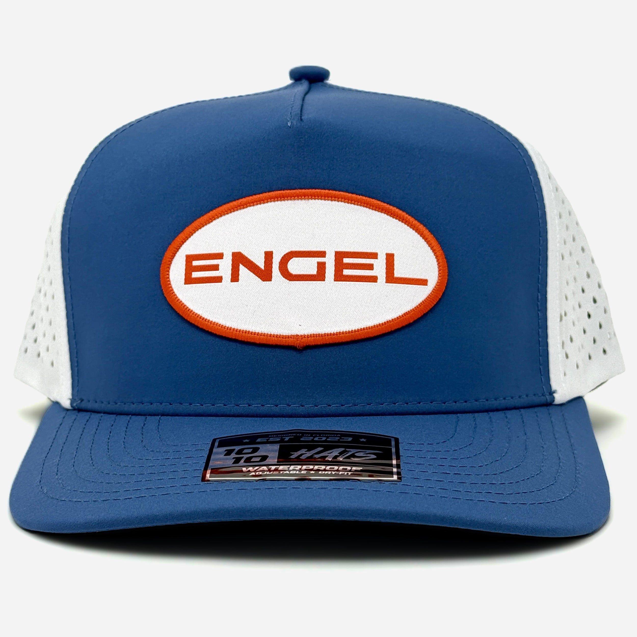 The Engel Coolers 1010 Performance Trucker Cap features blue and white panels, a white and orange "ENGEL" logo patch on the front, breathable mesh sides, and a black sticker on the brim.