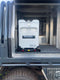 An ENGEL Standard Low-Profile Front Pull Fridge Slide is sitting in the back of a truck.
