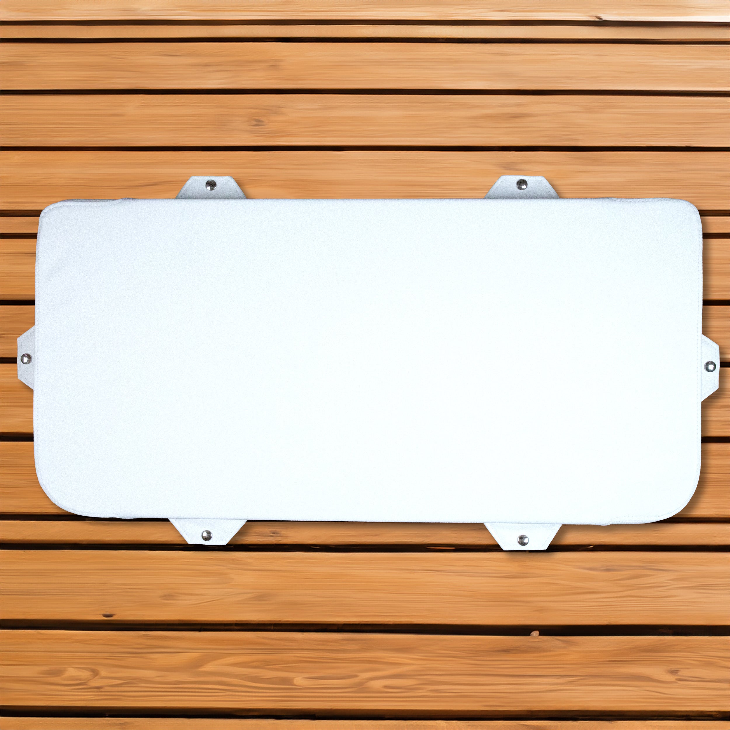 A white Engel Coolers Seat Cushion on a marine-grade wooden surface.