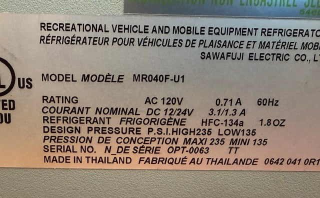 Label on this corrosion-resistant Engel Coolers MR040 Top Opening Fridge-Freezer shows model MR040F-U1, rated at AC 120V, 0.71A, 60Hz, using HFC-134a refrigerant and made in Thailand. Designed as a marine fridge freezer, the label also lists serial number and pressure specifications.