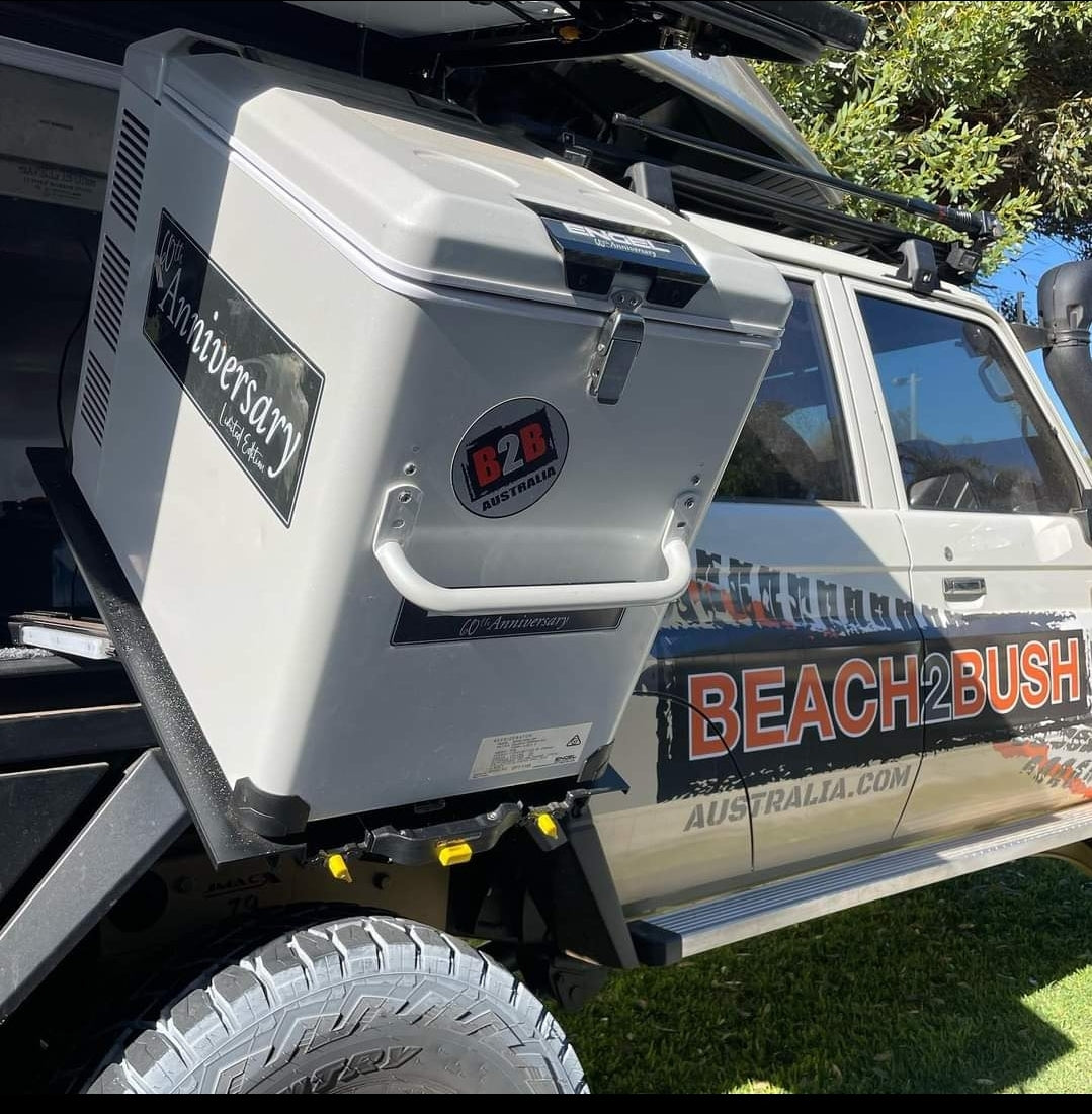 A large white ENGEL Low-Profile Front-Pull Tilt Fridge Slide on a vehicle.