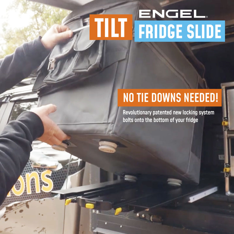 Person demonstrating an ENGEL Low-Profile Front-Pull Tilt Fridge Slide on a vehicle without the need for tie-downs.