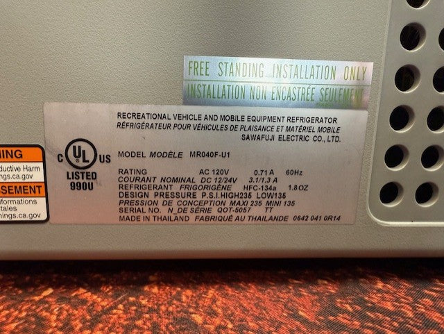 The Engel Coolers MR040 Top Opening Fridge-Freezer label shows model MR040F-U1, electrical specs, refrigerant type, and installation notice for RVs and mobile gear—perfect for corrosion resistance in marine settings.