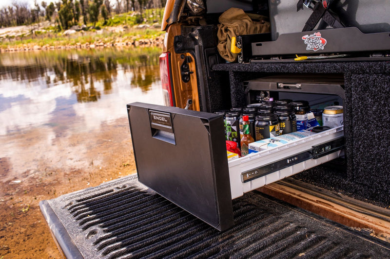 A truck with an Engel Coolers SB30 Drawer Style 12/24V DC Only Fridge-Freezer in the back of it.