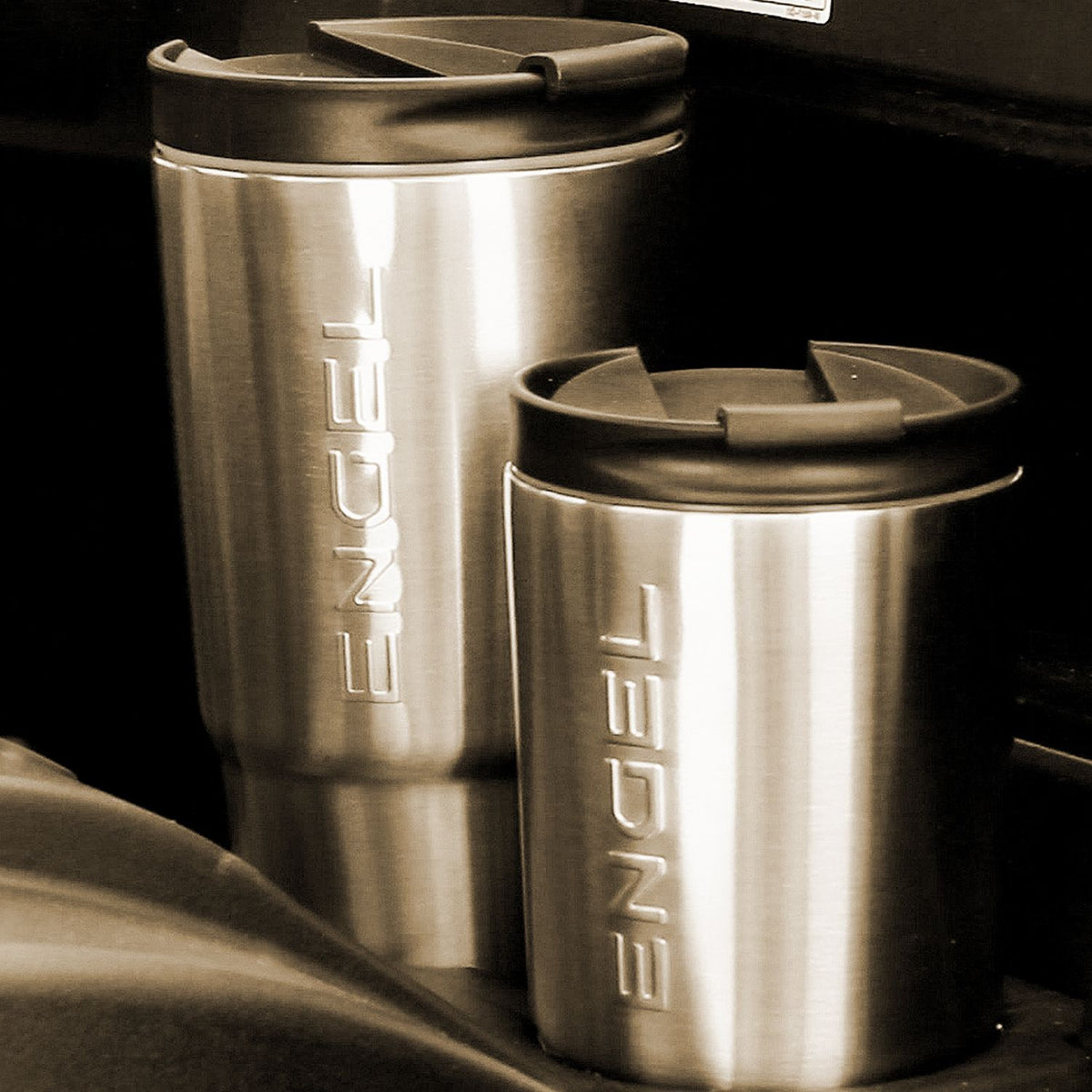 Two Engel Coolers 30oz Black Stainless Steel Tumblers with liquid-tight lids in a black and white photo.